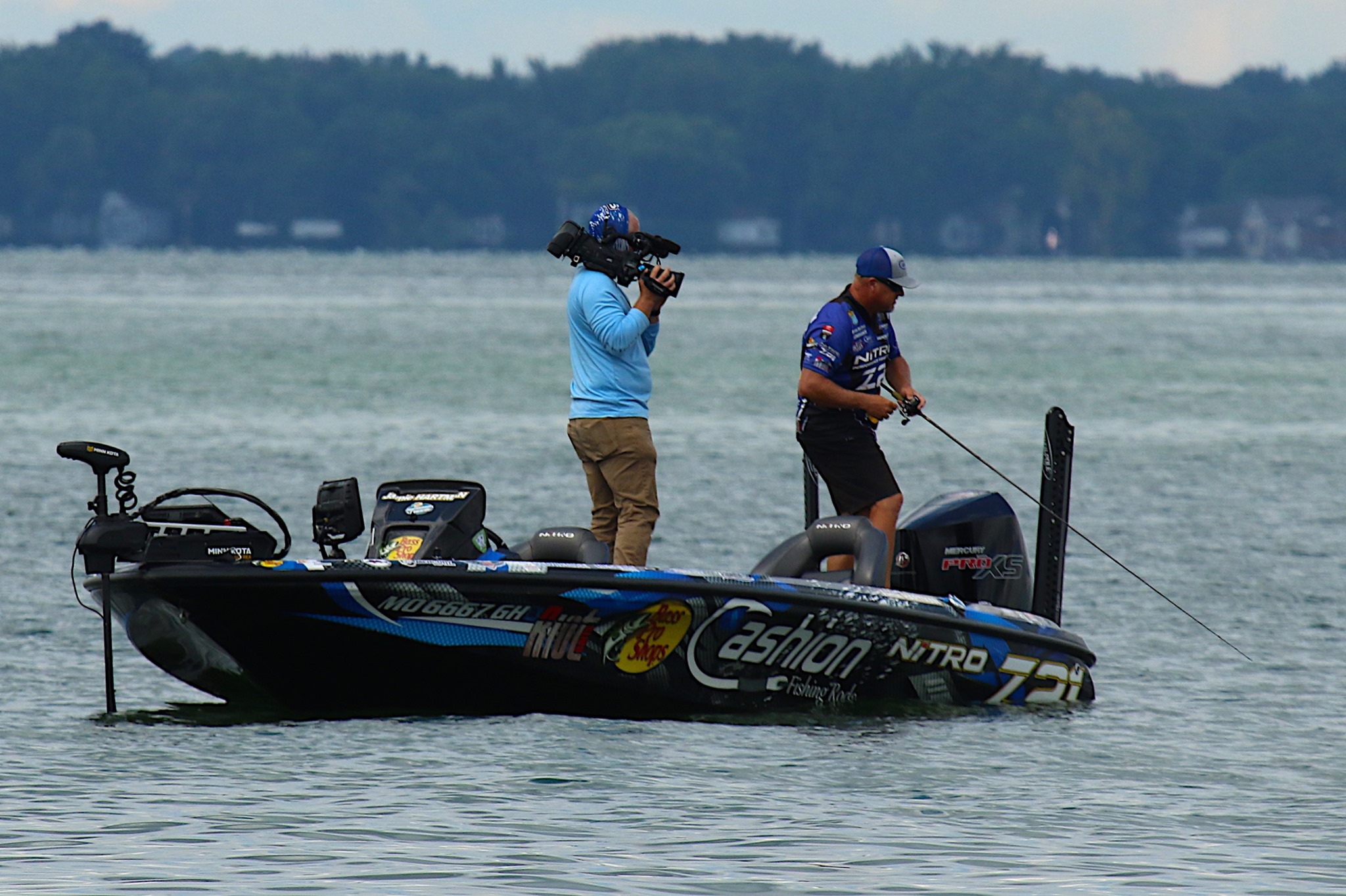 Captain Jamie Hartman fishing on the Bassmaster Elite Series with cameraman filming